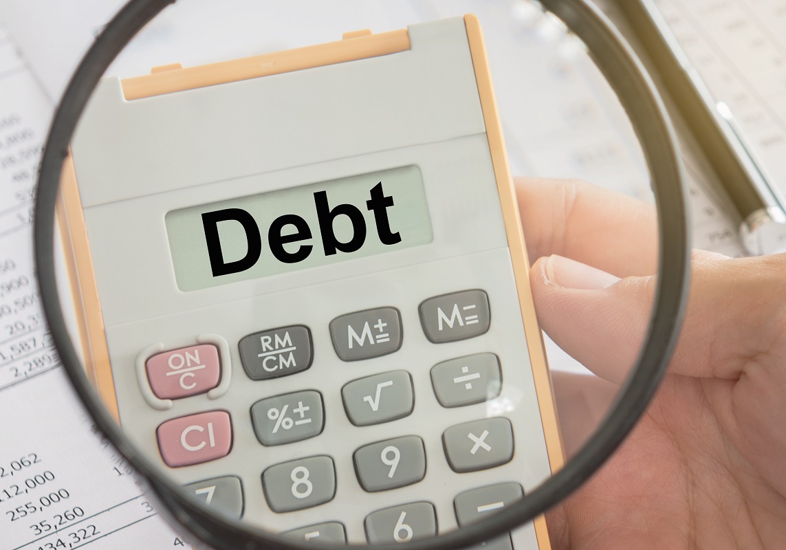 debt written on a calculator